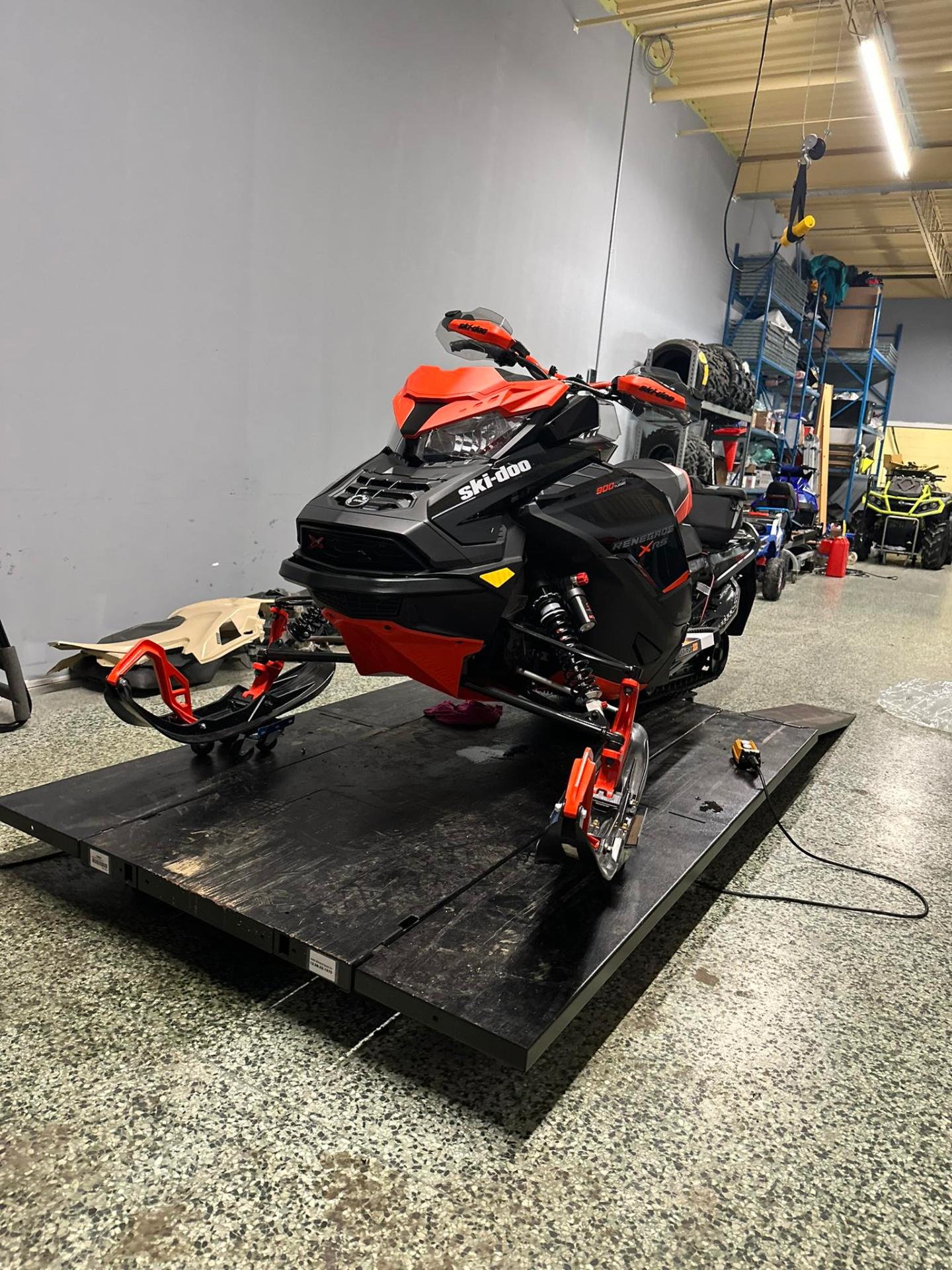 Ski-Doo Renegade X-RS on the lift at MJC Xtreme shop in Innisfil Ontario